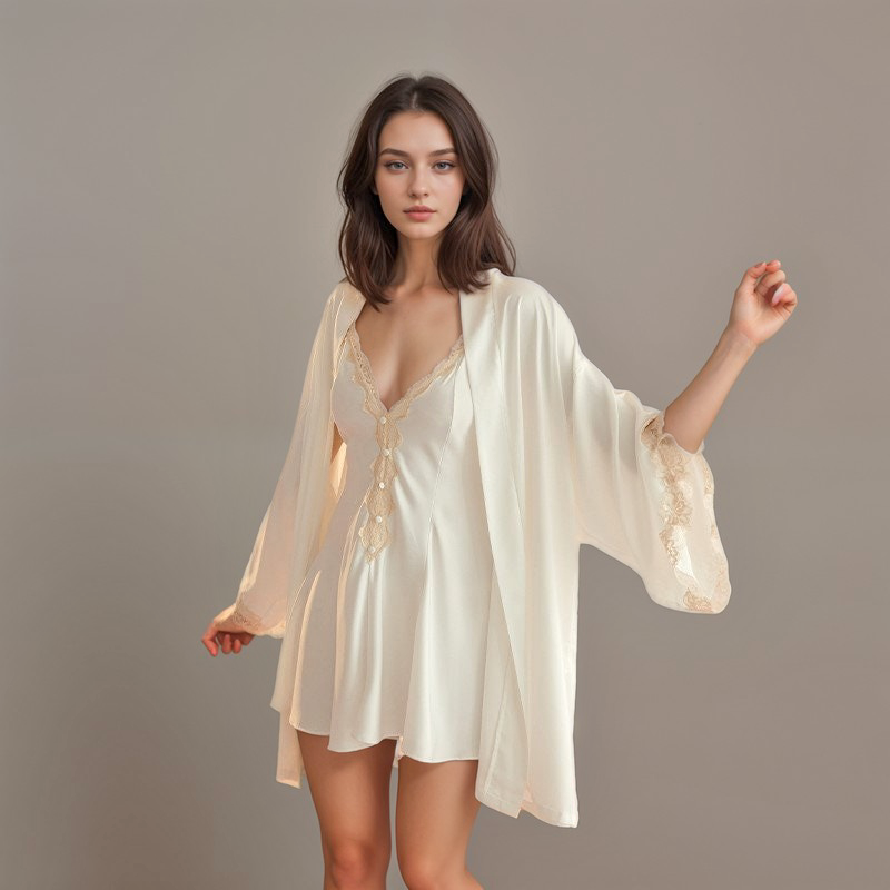 SelenaHuanStudio cream satin robe with lace-trim cuffs over a matching lace slip on a model.